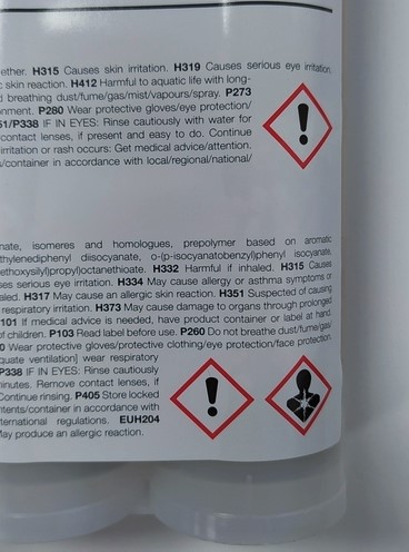 Hazard label on the back of the adhesive product